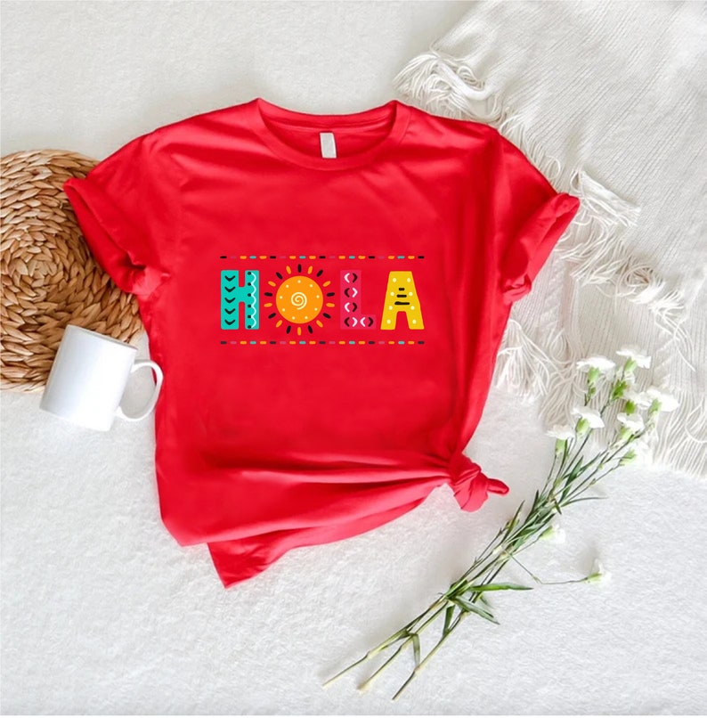 a red t - shirt with the letters a, b, and c on it