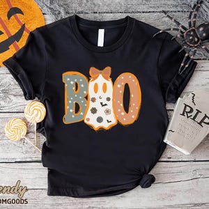 a black shirt with the word boo on it