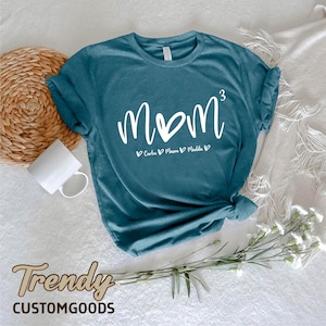 a t - shirt with the word mom written on it