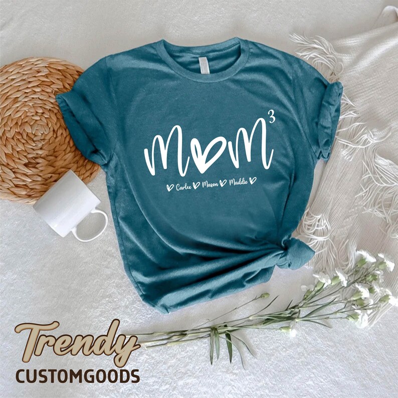 a t - shirt with the word mom written on it