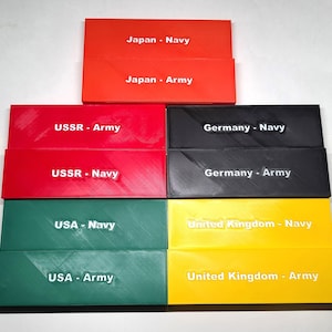 May include: Eight rectangular blocks, each with a different colour and text. The blocks are arranged in two rows of four. The top row reads "Japan - Navy", "Japan - Army", "USSR - Army", and "Germany - Navy". The bottom row reads "USSR - Navy", "Germany - Army", "USA - Navy", and "United Kingdom - Navy".