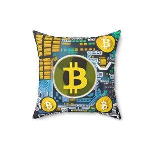 May include: A black and blue pillow with a circuit board design and multiple yellow Bitcoin symbols. The largest Bitcoin symbol is in the centre of the pillow and is surrounded by a silver ring.