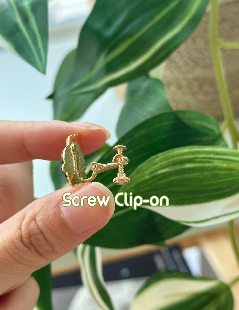 May include: Gold screw-on earring clip. The clip is designed to hold earrings in place for those with sensitive ears.