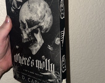 May include: A black and white book cover with a skull and the text "Where's Molly? A cat & mouse spin-off. Today bestselling author H.D. Carlton."