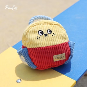 May include: A plush dog toy in yellow, red, and blue corduroy fabric, with embroidered facial features and a rope handle. The toy has the "PawFoo Lab" logo on a small tag.