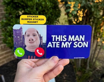 May include: A rectangular bumper sticker with a blue background and white text that reads THIS MAN ATE MY SON. The left side features a digital image of a person with a pig-like face filter, a green phone icon, and a red phone icon.