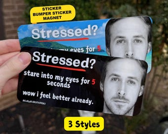 May include: Two rectangular stickers featuring a black and white portrait of a man. The top sticker has a blue background with the text Stressed? stare into my eyes for 5 seconds. The bottom sticker is black with the text Stressed? stare into my eyes for 5 seconds. wow i feel better already.