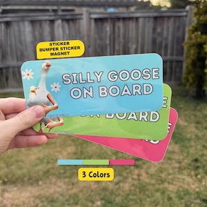 May include: A rectangular bumper sticker or magnet featuring a white goose with human-like arms, white daisy flowers, and the text SILLY GOOSE ON BOARD. The product is available in light blue, lime green, and bright pink colour variations.