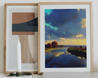 May include: A framed landscape painting of a river with trees on the banks and a cloudy sky. The painting is on a white desk with a laptop, candles, and a stack of books.