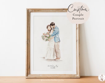 May include: A watercolor painting of a couple in a wedding portrait. The bride is wearing a white dress and the groom is wearing a blue suit. They are holding a bouquet of flowers. The painting is framed in a gold frame and has the text "Our Wedding Day 3.11.2022" and "@sonderfulbespoke" at the bottom.