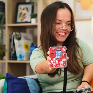 Woman playing with CircuitMess Bit 2.0