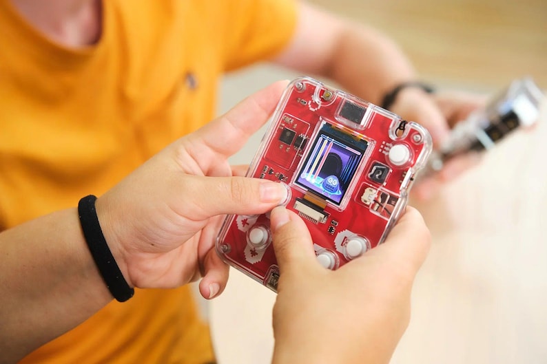 Woman playing with CircuitMess Bit 2.0
