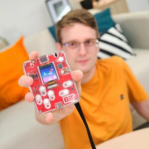 Man playing with CircuitMess Bit 2.0