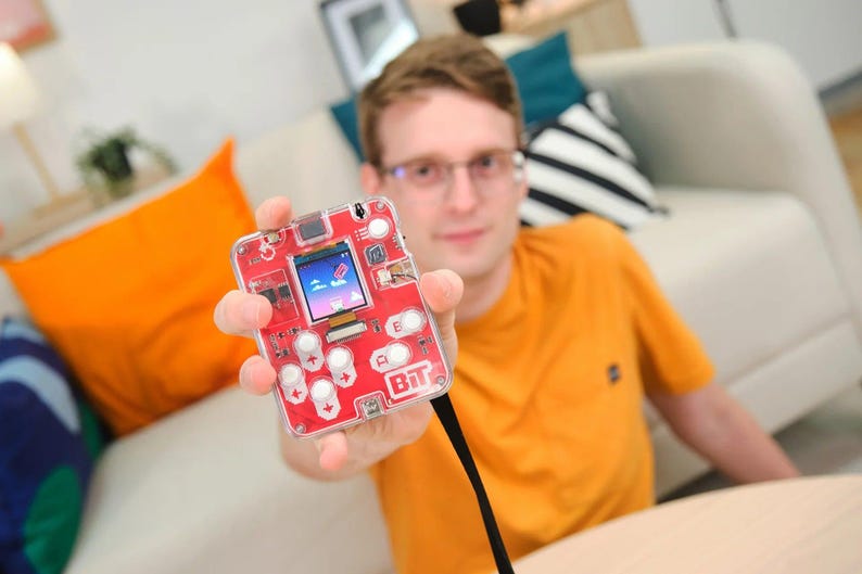Man playing with CircuitMess Bit 2.0