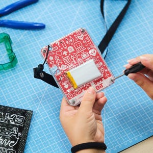 Man playing with CircuitMess Bit 2.0