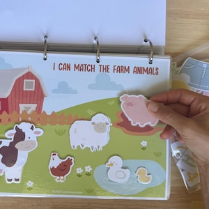 Completing the “I Can Match the Farm Animals” activity