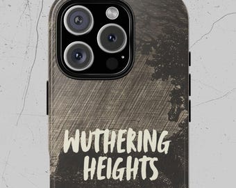 May include: A phone case with a dark, textured background and the title "Wuthering Heights" in white, stylized text. The author's name, Emily Bronte, is printed below the title. The case has a camera module with three lenses.