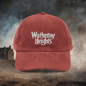 Burnt Orange (listed as burgundy) cotton corduroy baseball cap with adjustable strap and white embroidered text reading 'Wuthering Heights' inspired by the book Wuthering Heights By Emily Brontë.