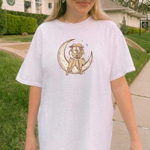 Two Sapphic Lesbian Cowgirls Sitting On Crescent Moon White Short Sleeve T-Shirt