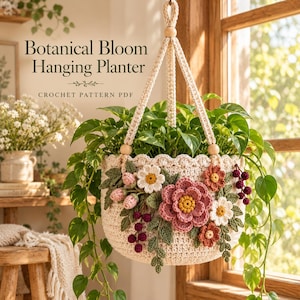 May include: A cream-coloured crochet hanging planter featuring decorative floral appliqués in shades of pink, white, and rust, with green leaves and dark berry clusters. The text Botanical Bloom Hanging Planter CROCHET PATTERN PDF is visible.