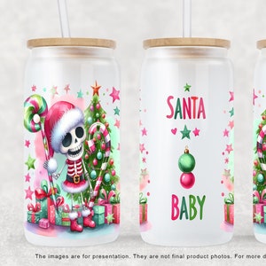 May include: Three white tumblers with a Christmas theme. The tumblers feature a cartoon skeleton wearing a Santa hat and holding a candy cane. The middle tumbler has the text "SANTA BABY" in pink and green letters.