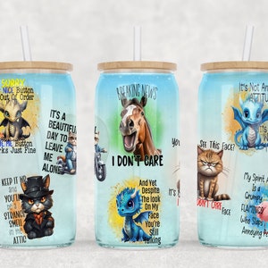 May include: Three stainless steel tumblers with colorful cartoon animal graphics and humorous text. The tumblers feature a dragon, a horse, and a cat. The text on the tumblers includes phrases like "Sorry, my nice button is out of order", "It's a beautiful day to leave me alone", "Breaking news, I don't care", "It's not an attitude, it's the way I am", and "See this face? I don't care".
