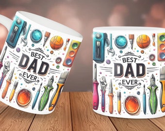 May include: Two white ceramic mugs with a colorful design featuring tools, paintbrushes, and the text "Best Dad Ever".