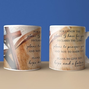 May include: White ceramic mug with a brown wooden cross and a bible verse that reads "For I know the plans I have for you, declares the Lord, plans to prosper you and not to harm you, plans to give you hope and a future."
