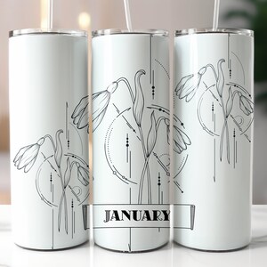 May include: White stainless steel tumbler featuring a black and white illustration of snowdrops and geometric designs. The tumbler has a black banner with the word "JANUARY" printed on it.