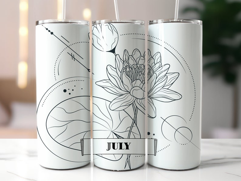 May include: Three white stainless steel tumblers with black line drawings of a lotus flower and leaves. The tumblers have a geometric design and the word "JULY" is written on the middle tumbler.