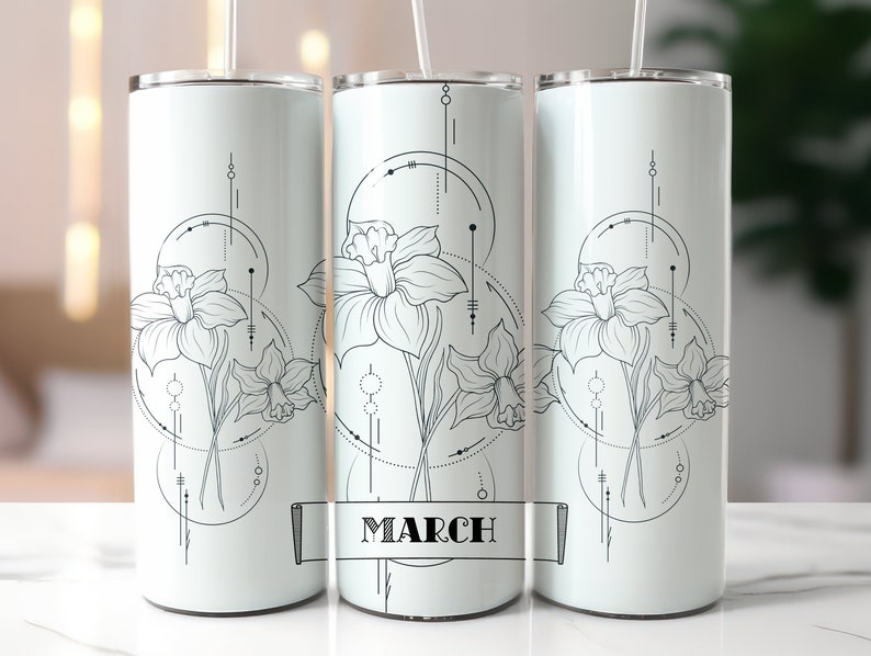 May include: White stainless steel tumbler featuring a black and white graphic of a daffodil flower with geometric shapes and the word "March" on a banner.