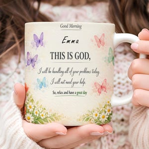 May include: White ceramic mug with a handle, featuring the text "Good Morning Emma, THIS IS GOD," and a motivational message. The mug is decorated with colorful butterflies and floral accents.