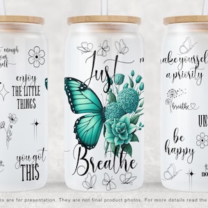 May include: Three white tumblers with black text and a turquoise butterfly design. The tumblers feature inspirational quotes such as "Just Breathe", "Make Yourself a Priority", and "You Got This".