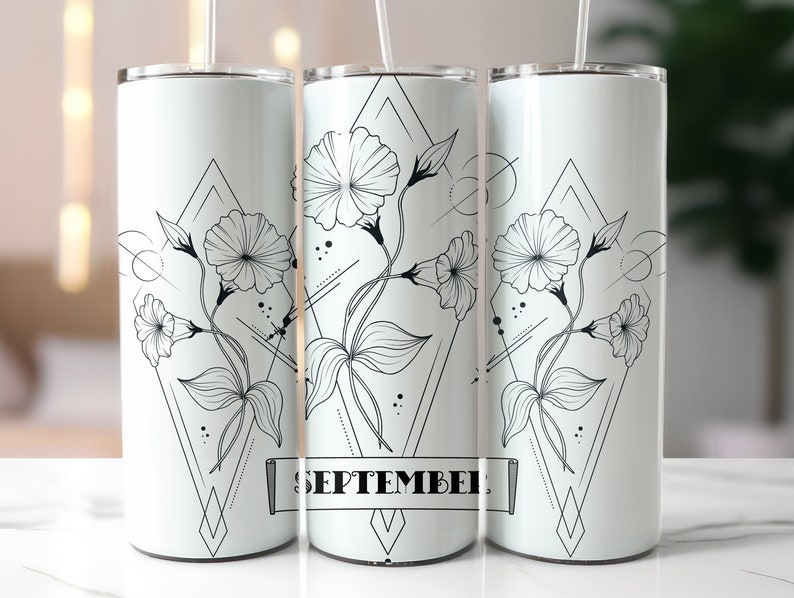 May include: White stainless steel tumbler with a black and white geometric design featuring stylised flowers and the word "SEPTEMBER".