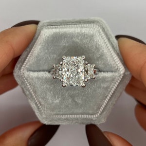 Radiant Cut 5 carat IGI Certified E Color VVS2 Clarity Lab Grown Diamond Three Stone Engagement Ring, Side Trapezoids, 18K Gold
