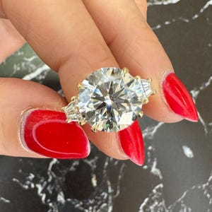 9 Carat Total E Color VS1 Clarity IGI Certified Lab Grown Round Ideal Cut Diamond Three Stone Engagement Ring Side Baguettes 18k Yellow Gold