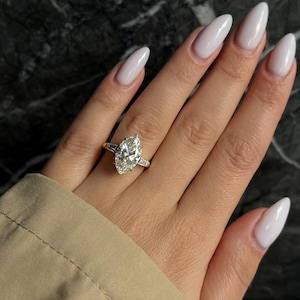 E Color VVS2 Clarity Marquise Cut 3.5 carat IGI Certified Lab Grown Diamond Three Stone Engagement Ring Side Baguettes Handmade of 14k Gold