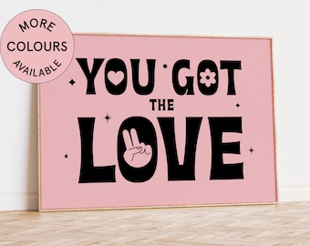 May include: Pink background with black text that reads "You got the love" with a peace sign and a flower graphic.