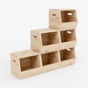 May include: A light-coloured wooden storage unit with six open compartments in a stepped design. The unit has cut-out handles. The text "D! Maker Another point of view" is in the upper left corner.