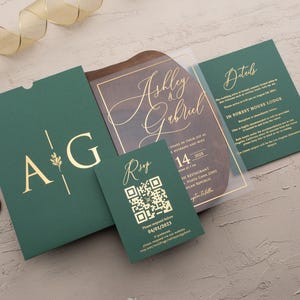 Clear acrylic wedding invitation with rose gold foil, emerald green sleeve envelope and optional QR RSVP and details cards.