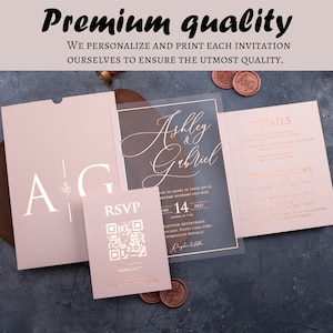 Premium quality graphic above a blush pink acrylic wedding invitation suite with optional QR RSVP and details cards.