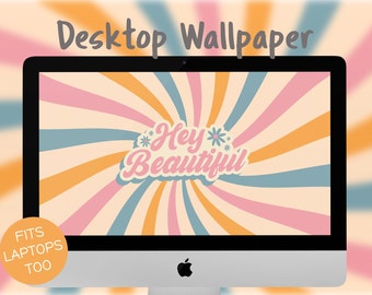 May include: A computer screen displaying a retro-style desktop wallpaper with a swirling pattern of orange, pink, and blue stripes. The text "Hey Beautiful" is in a pink, white, and blue font with a flower graphic on either side. The text "Fits Laptops Too" is in a circle on the bottom left corner of the screen.