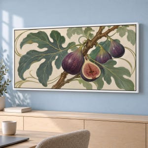 May include: A rectangular wall art print featuring a botanical illustration of purple figs on a branch with large green leaves. One fig is sliced open to reveal a pink interior with seeds, set against a cream background in a white frame.