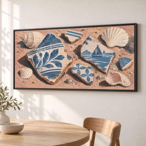 May include: A rectangular wall art print in a black frame featuring a collection of blue and white ceramic pottery shards mixed with various seashells on a sandy beige background. The shards display floral patterns and a sailboat scene.
