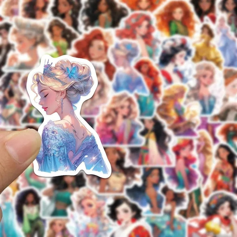 May include: A sheet of colorful stickers featuring various Disney princesses. The stickers are printed on white paper and have a glossy finish. The princesses are depicted in various poses and outfits, including Cinderella, Snow White, Ariel, and Belle.