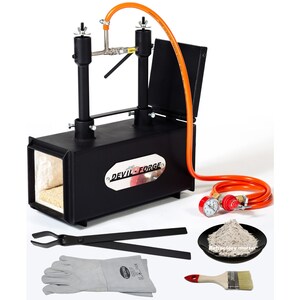 May include: A black metal forge with an orange hose and a black lid. The forge has a label that says "DEVIL FORGE". The image also shows a pair of tongs, a pair of welding gloves, a small bag of refractory mortar, and a paint brush.