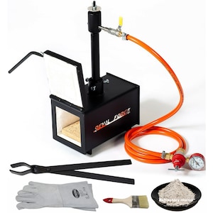 May include: A black metal forge with an orange hose and a pressure gauge. The forge has a small door and a handle. The forge is labelled "Devil Forge". The image also includes a pair of tongs, a pair of welding gloves, a paint brush, and a small bowl of refractory mortar.