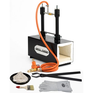 May include: A black metal forge with an orange hose and a white refractory brick lining. The forge is labelled "DEVIL-FORGE". The image also shows a small bowl of refractory mortar, a pair of tongs, a paintbrush, and a pair of welding gloves.
