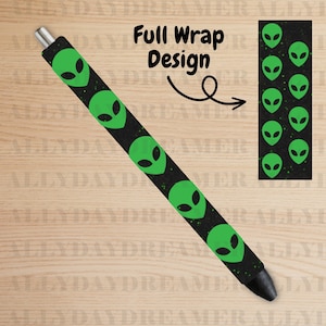 May include: A black pen with a full wrap design featuring green alien heads on a black background with white speckles. The text "Full Wrap Design" is written above the pen.