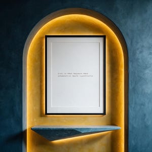 Entrepreneurial mindset typography print, golden limewash arch wall decor above a stone shelf, a motivating gift for a hard working founder.